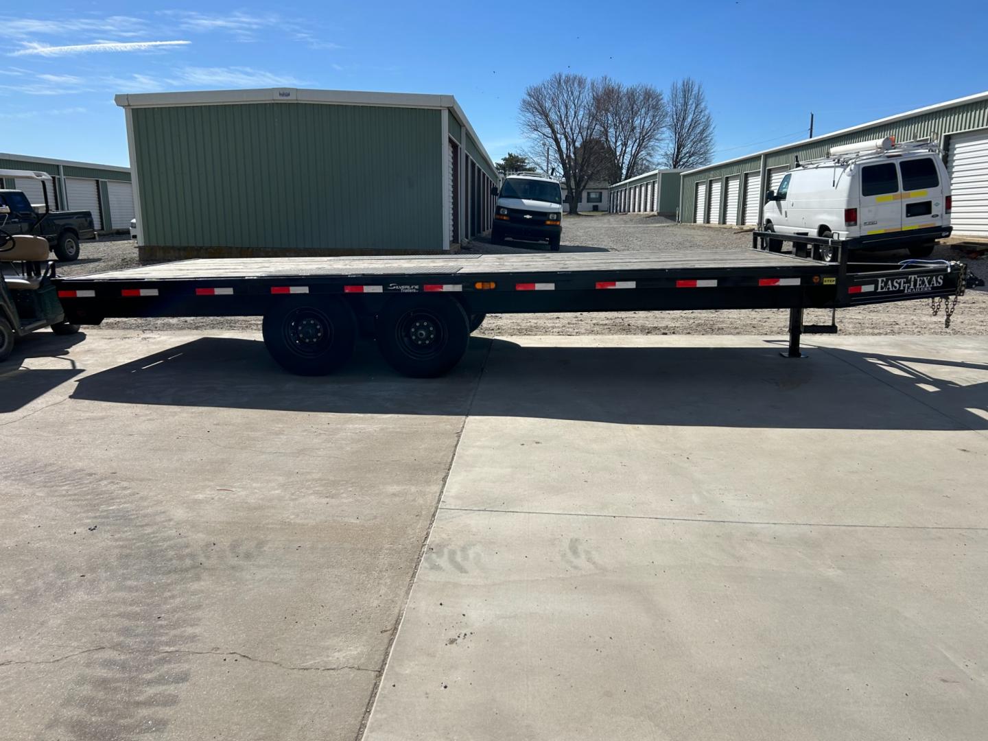 2022 BLACK EAST TEXAS TRAILER FLATBED (58SBF2021NE) , located at 17760 Hwy 62, Morris, OK, 74445, 35.609104, -95.877060 - 2022 EAST TEXAS TRAILER IS 20X8 FT. INCLUDES RAMPS DUAL AXLE GVWR 14,000 LB TITLE IN HAND $6,900 CALL RUSS OR JONA AT 918-733-4887 - Photo#1